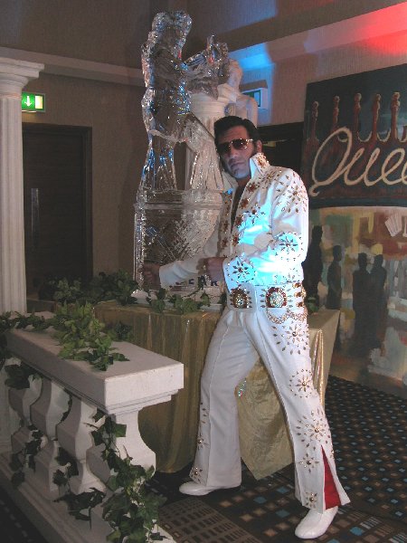 Next to an Elvis sculpture